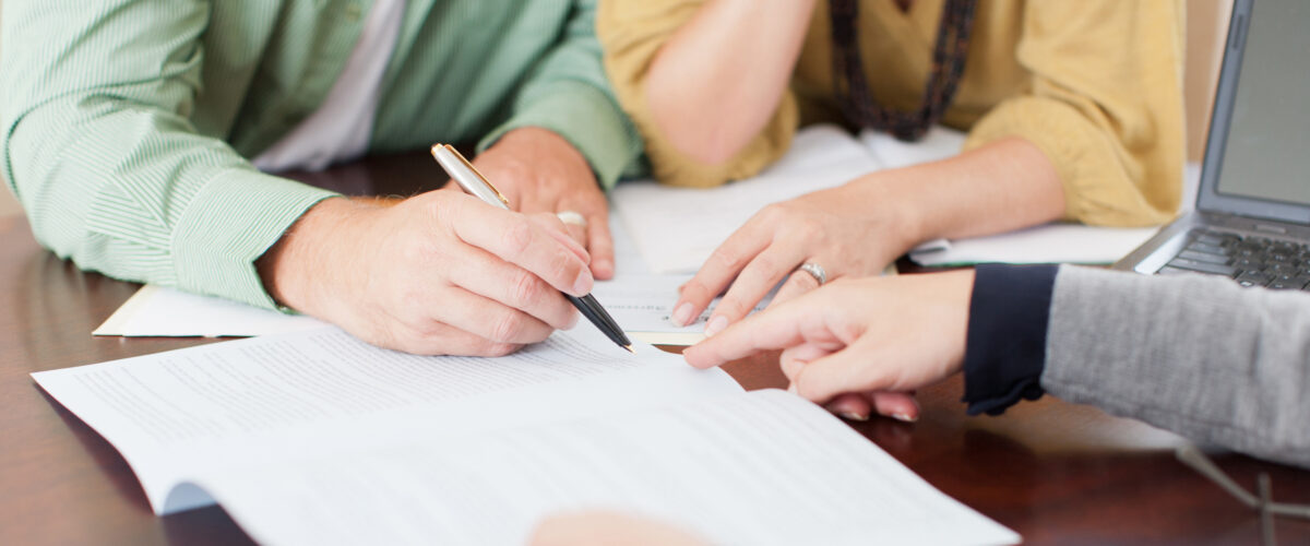 Couple signing contract
